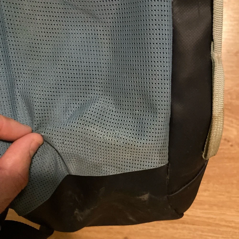 cotopaxi navy blue light blue green striped backpack